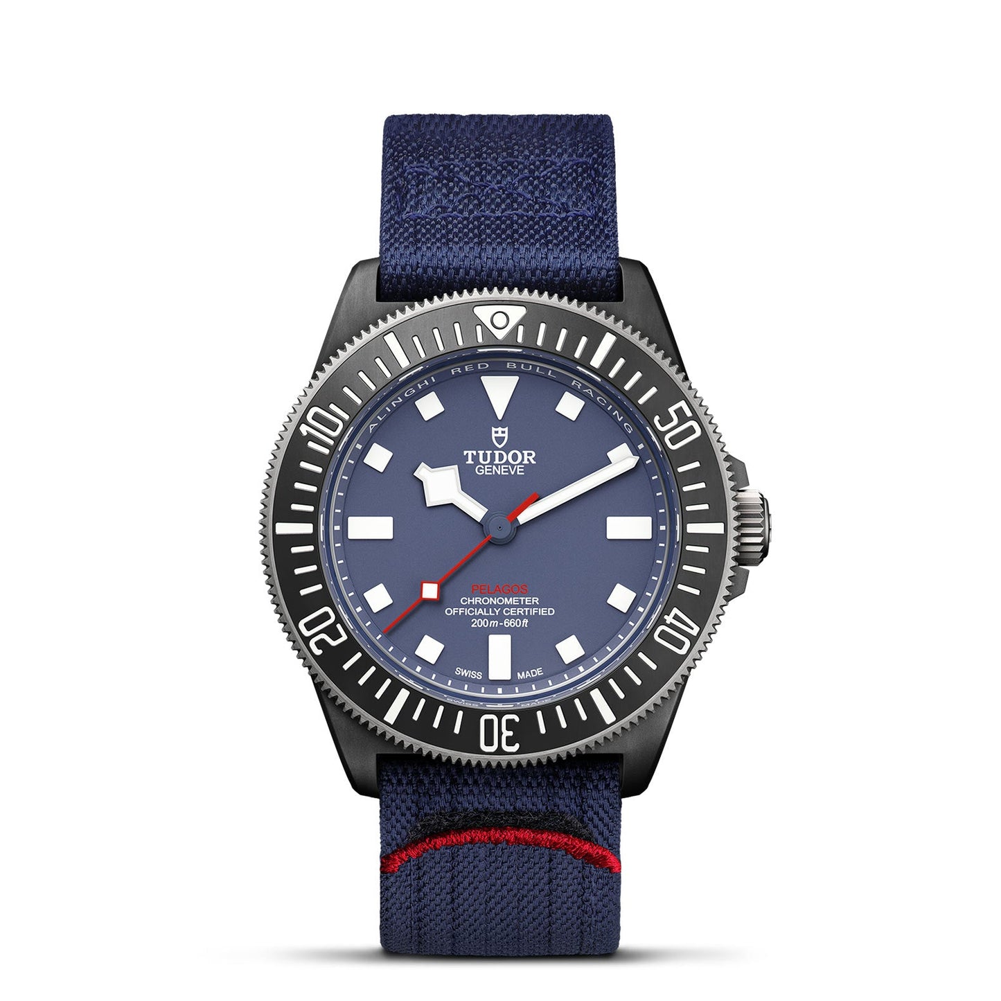 The TUDOR Pelagos FXD is a specialized diving watch featuring a blue dial with white hour markers and the "TUDOR" logo on display. Its blue textile strap, highlighted with a red accent, pairs perfectly with the metallic bezel and case to create an elegant appearance.