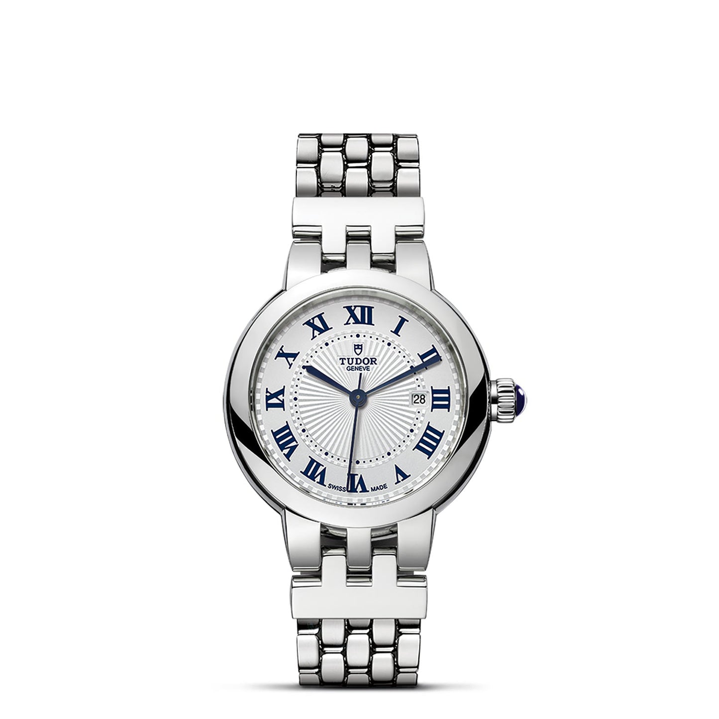 The TUDOR Clair de Rose is a silver wristwatch featuring a steel bracelet. Its white opaline dial showcases blue Roman numerals and includes a date display at 3 o'clock. This sophisticated timepiece is finished with an elegantly refined crown on the side.