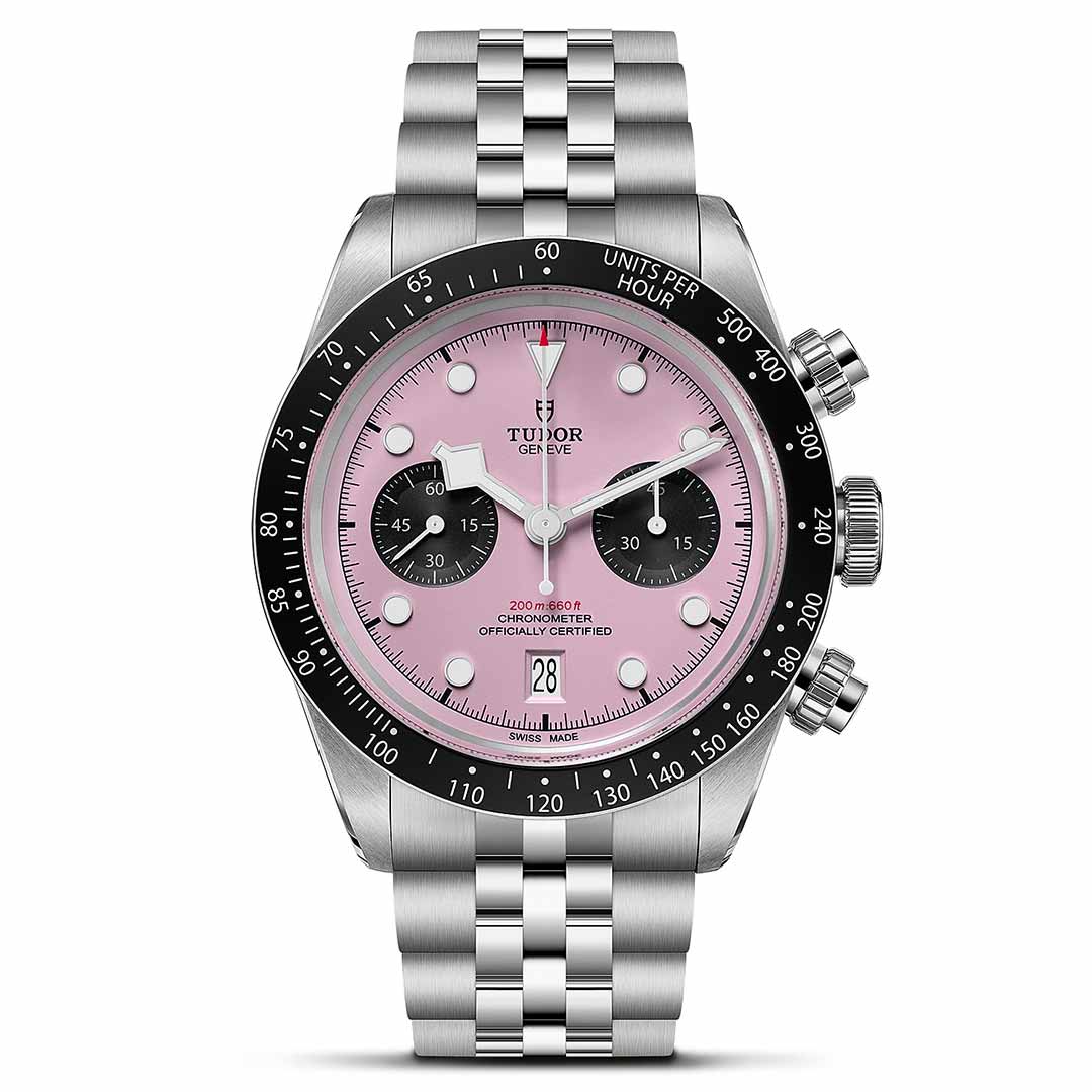 The TUDOR Black Bay Chrono features a steel case, pink dial with black subdials, black tachymeter bezel, date at 6 o’clock, and a silver link bracelet—a bold new addition to the TUDOR collection.