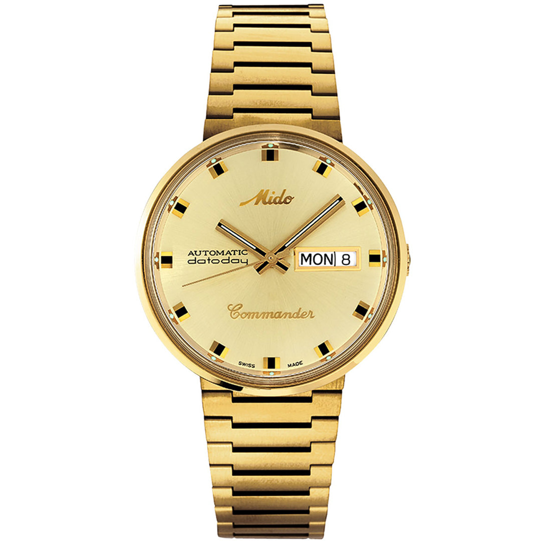 The MIDO Commander 1959 Automatic 37mm watch features a gold round face, integrated bracelet, black and gold hour markers, day and date windows on the right, and "Automatic," "datoday," and "Commander" on the dial.