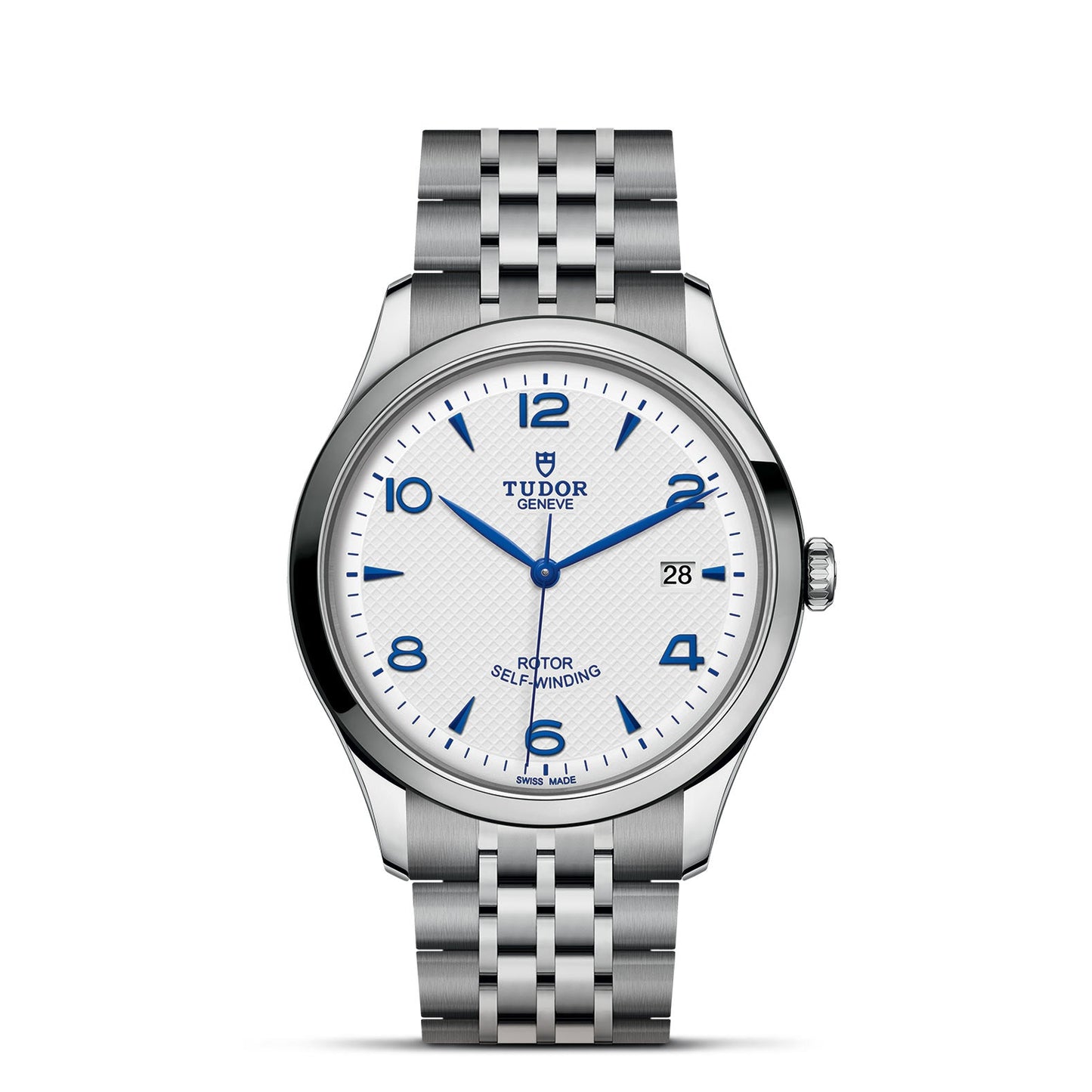 The TUDOR 1926 stainless steel watch features a silver bracelet, white textured dial, blue numerals and hands, a date window at 3 o'clock, and branding text "Tudor Geneva" and "Rotor Self-Winding," capturing the allure of mechanical watches.