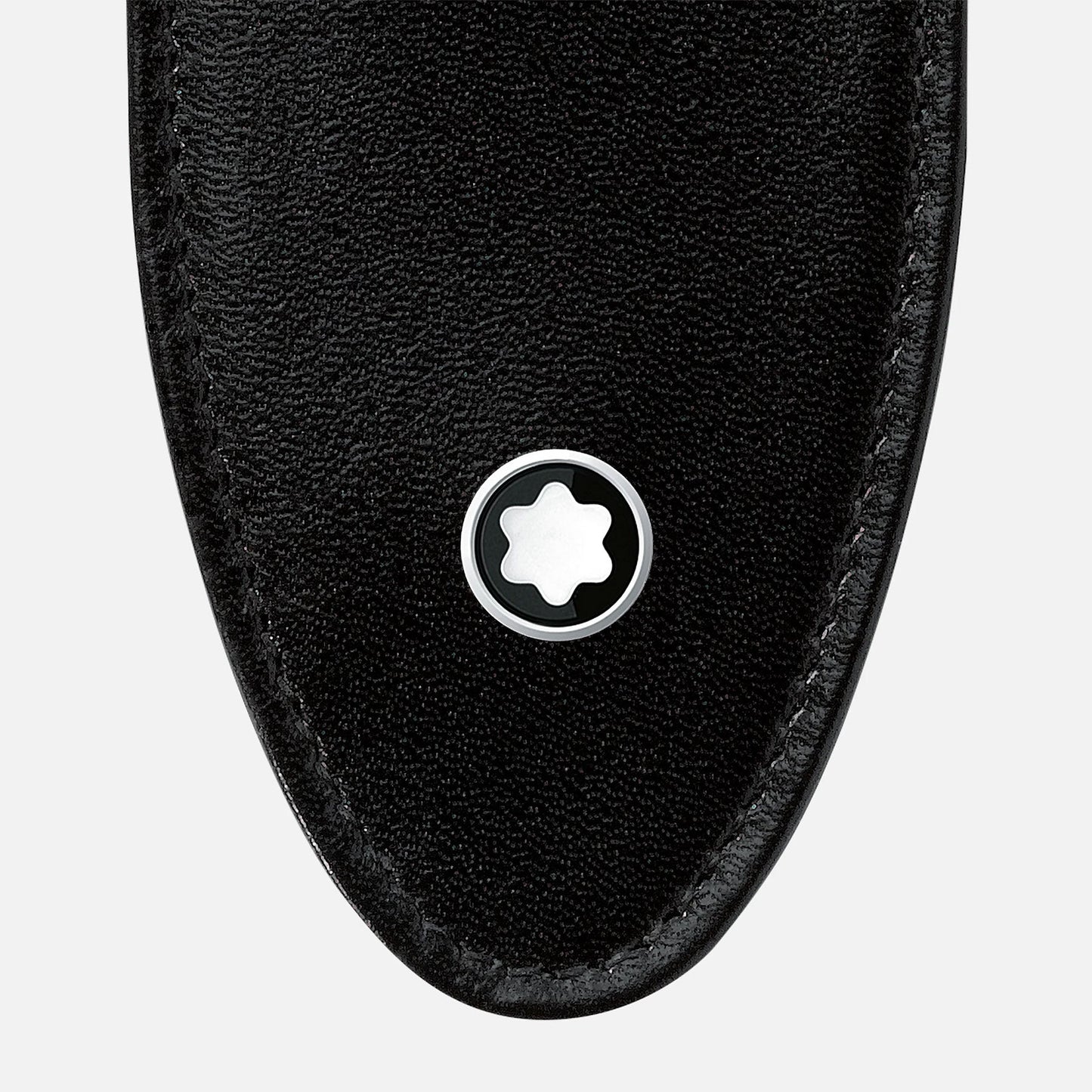 The close-up highlights the Montblanc Meisterstück Soft Grain Leather Pen Pouch, showcasing its black leather design with a rounded tip. A circular metal emblem featuring a white six-pointed star is centrally displayed against a plain white background.