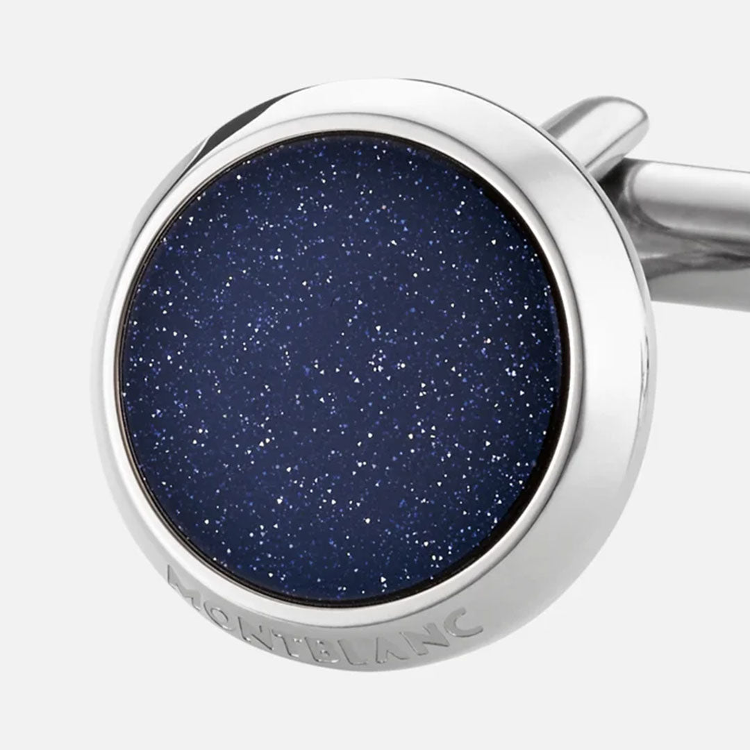 Introducing the Montblanc Meisterstück Blue Goldstone & Stainless Steel Cufflinks, these sophisticated silver accessories feature a circular design with a mesmerizing dark blue, starry-sky-like blue goldstone inlay. The iconic Montblanc brand name is engraved around the edge for an added touch of elegance.
