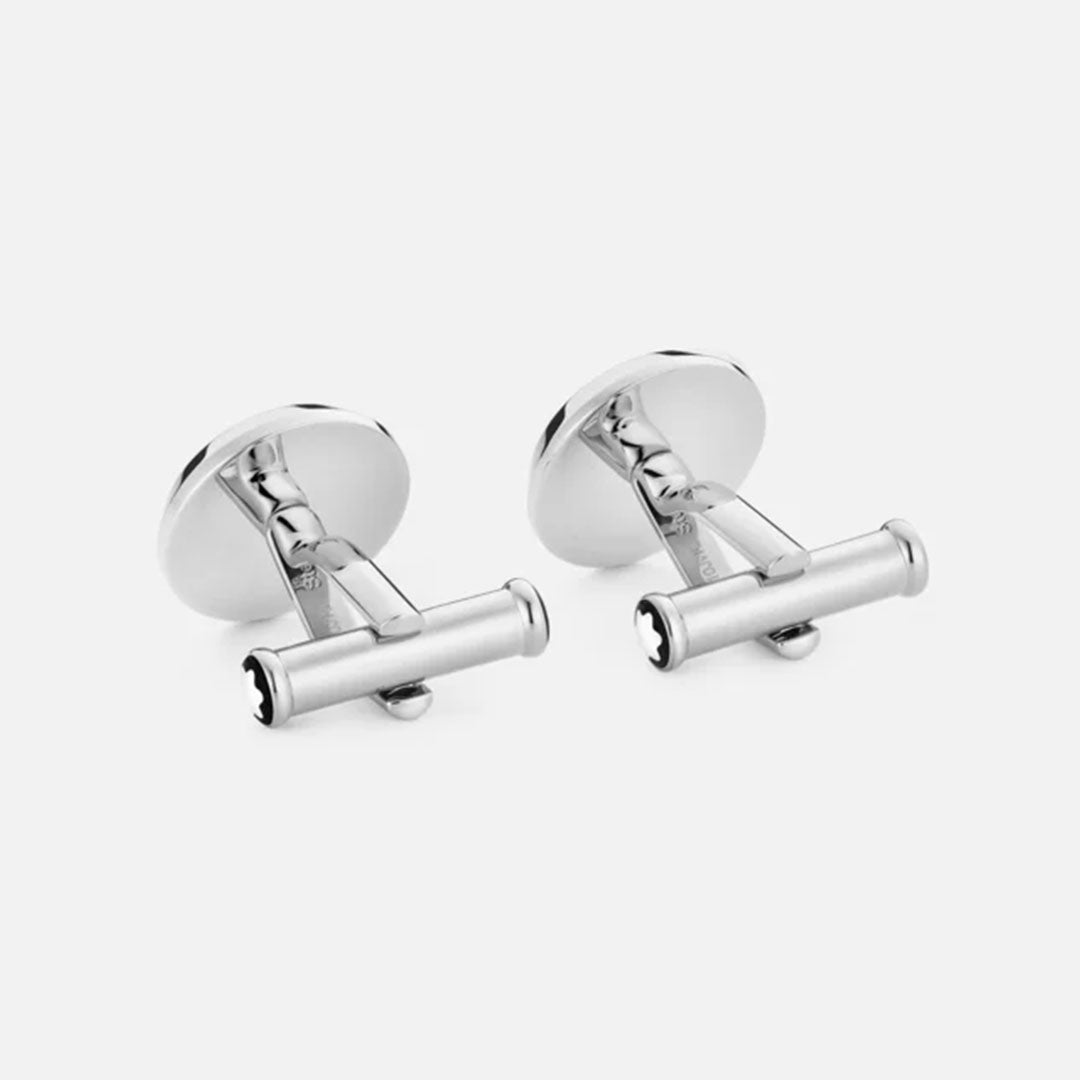 Positioned against a plain gray background, the Montblanc Carbon Pattern Stainless Steel Cufflinks exhibit a sleek cylindrical design. Crafted from stainless steel, these cufflinks feature smooth, shiny surfaces with flat, round backings connected to the cylindrical bar for an elegant touch.
