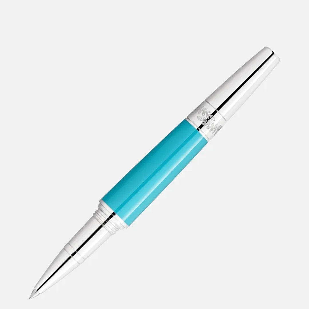The Montblanc Muses Maria Callas Special Edition Rollerball Pen features a chic turquoise barrel adorned with silver accents on both the cap and tip, all elegantly contrasted against a simple white background.