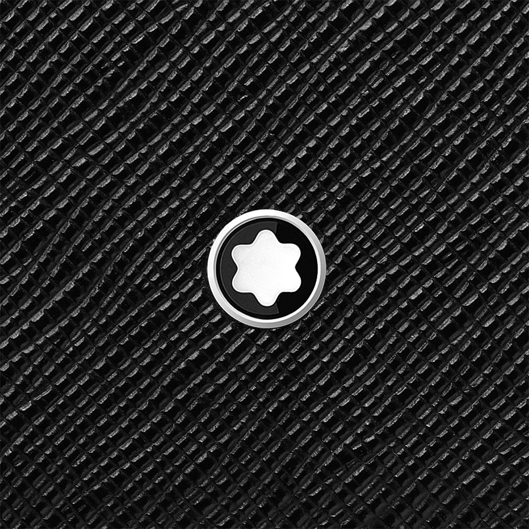 A close-up of the Montblanc Sartorial 4CC Leather Card Holder by Montblanc, showcasing textured black Saffiano leather and a central circular emblem with a white six-pointed star outlined in black and silver.