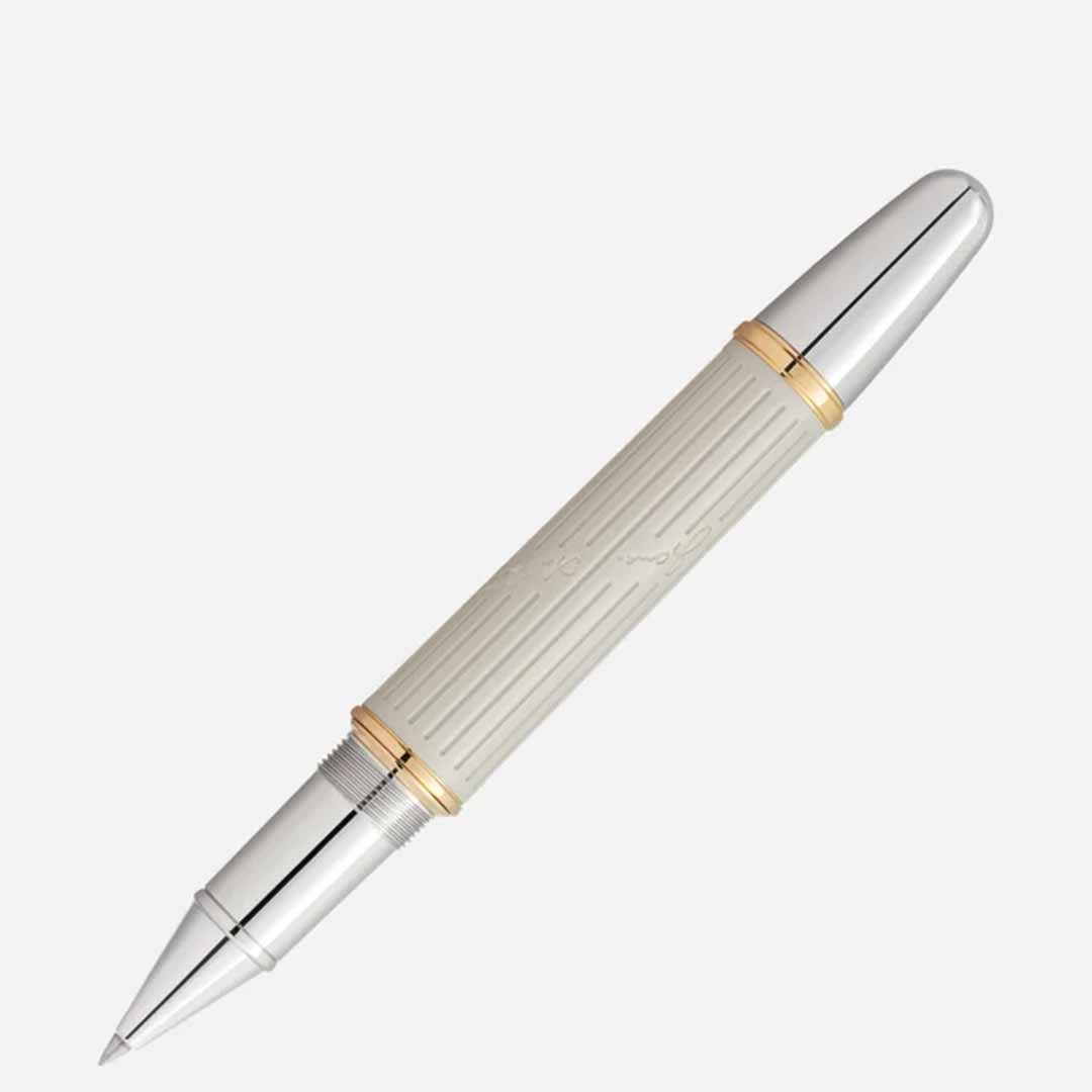The Montblanc Writers Edition Homage to Jane Austen Limited Edition Rollerball Pen boasts a luxurious design featuring a silver cap and tip paired with a cream-colored, ribbed barrel. Gold accents highlight its center and trim, enhancing its elegant Regency-era aesthetic. Resting diagonally on a plain white background, the pen embodies the timeless elegance reminiscent of Jane Austen's era.