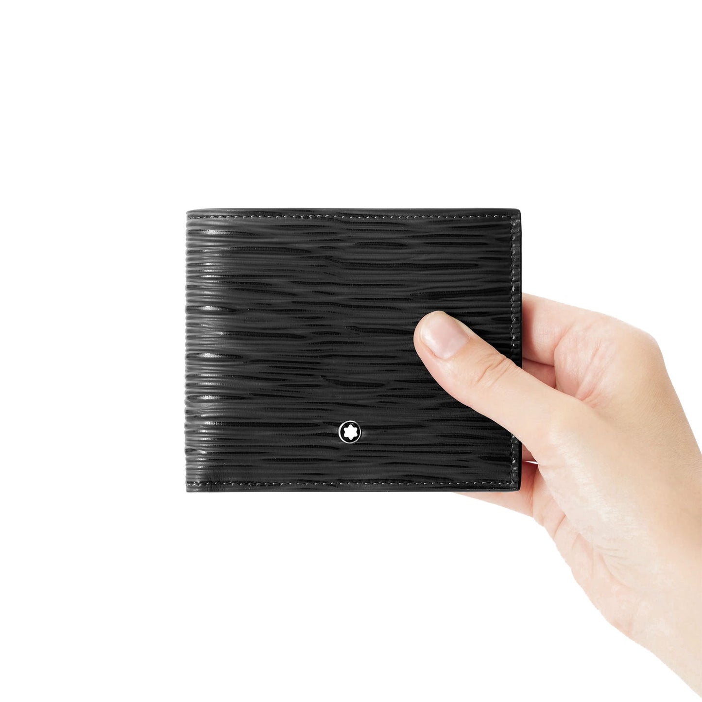 A hand holding a Montblanc Meisterstück 4810 8CC Black Leather Wallet, showcasing a textured pattern with the brand's emblem elegantly centered. The plain white background emphasizes the wallet's understated luxury.