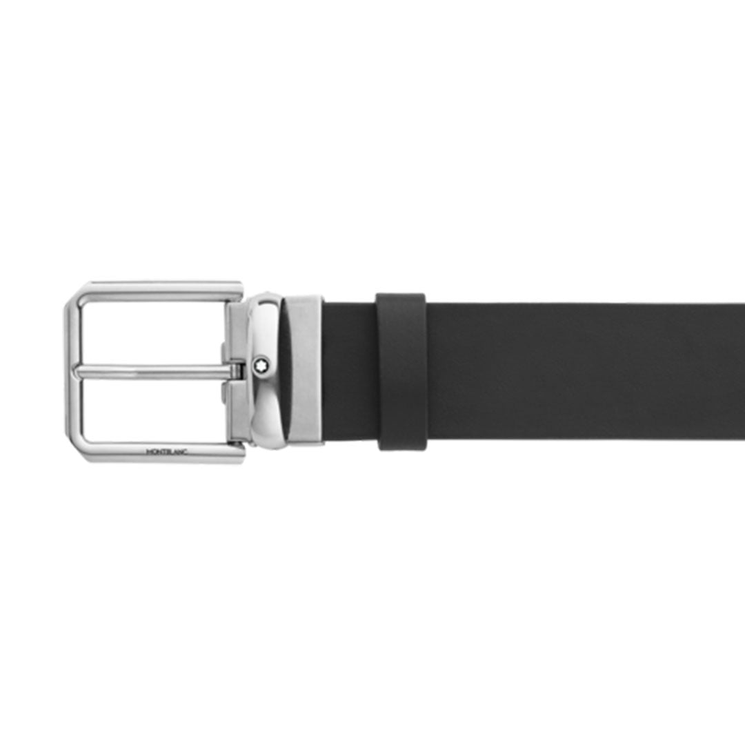 A sleek Montblanc 35mm black leather belt with a silver rectangular buckle is displayed on a white background. This reversible belt, featuring the iconic Montblanc emblem, highlights its modern and minimalist style.