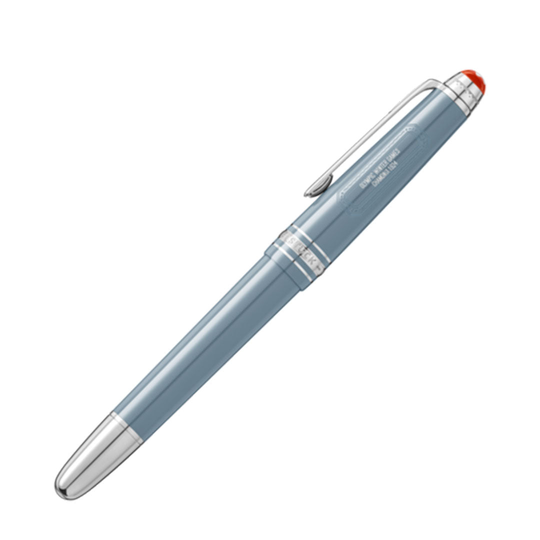 A Montblanc Meisterstück x Olympic Heritage Chamonix 1924 Classique fountain pen, featuring a blue body with silver trim and a red top, is displayed diagonally on a white background.