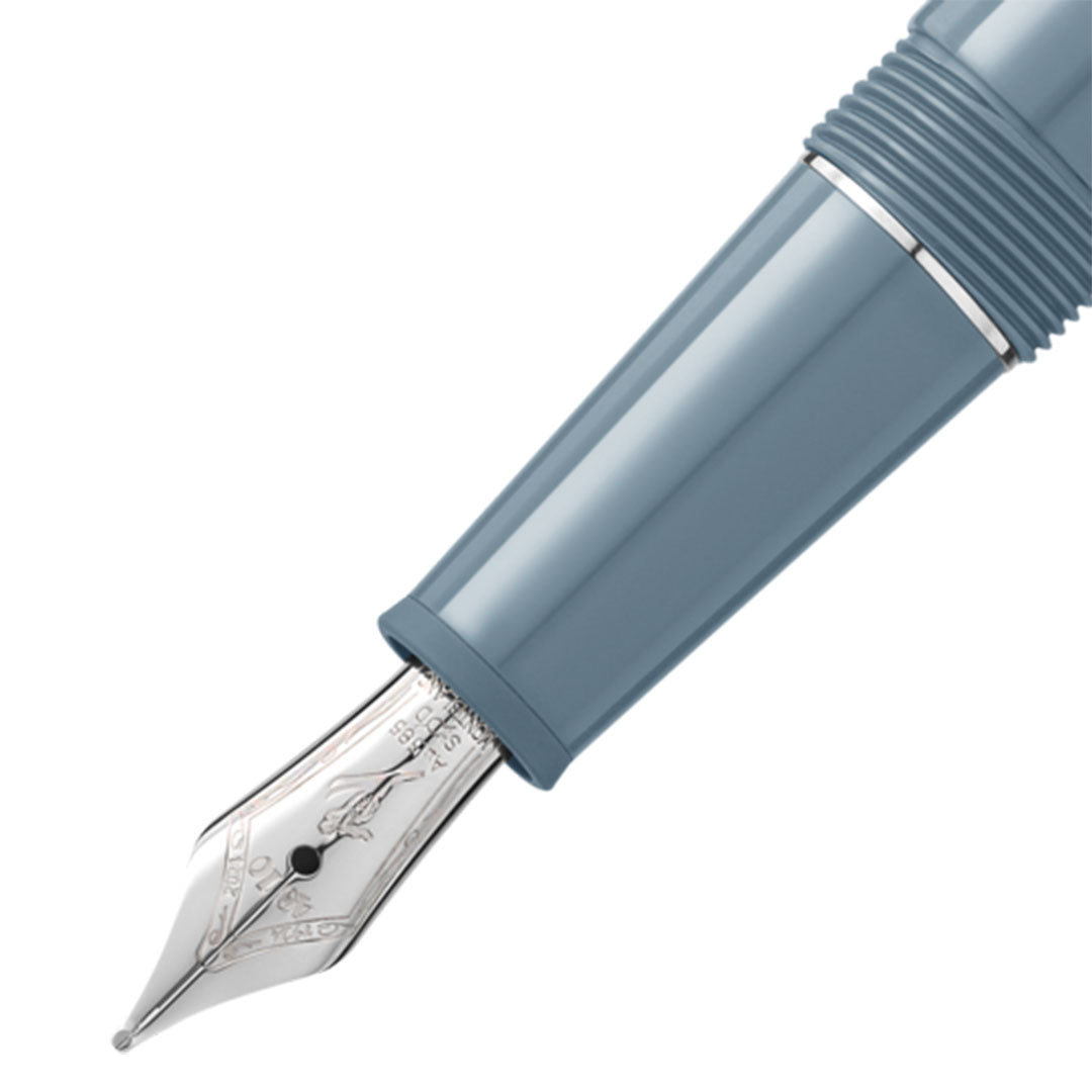 Close-up of the nib and grip section of the Montblanc Meisterstück x Olympic Heritage Chamonix 1924 Classique Fountain Pen. The pen's body is a sleek, glossy blue-grey with a metallic silver nib featuring intricate engravings, celebrating the Meisterstück centenary.