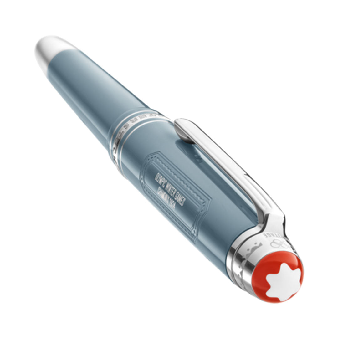 Discover the sophistication of a Montblanc Meisterstück x Olympic Heritage Chamonix 1924 Classique Fountain Pen. With its luxurious glossy blue barrel, silver clip, and a distinctive red and white emblem on the cap end, this engraved design embodies the timeless elegance associated with Montblanc.