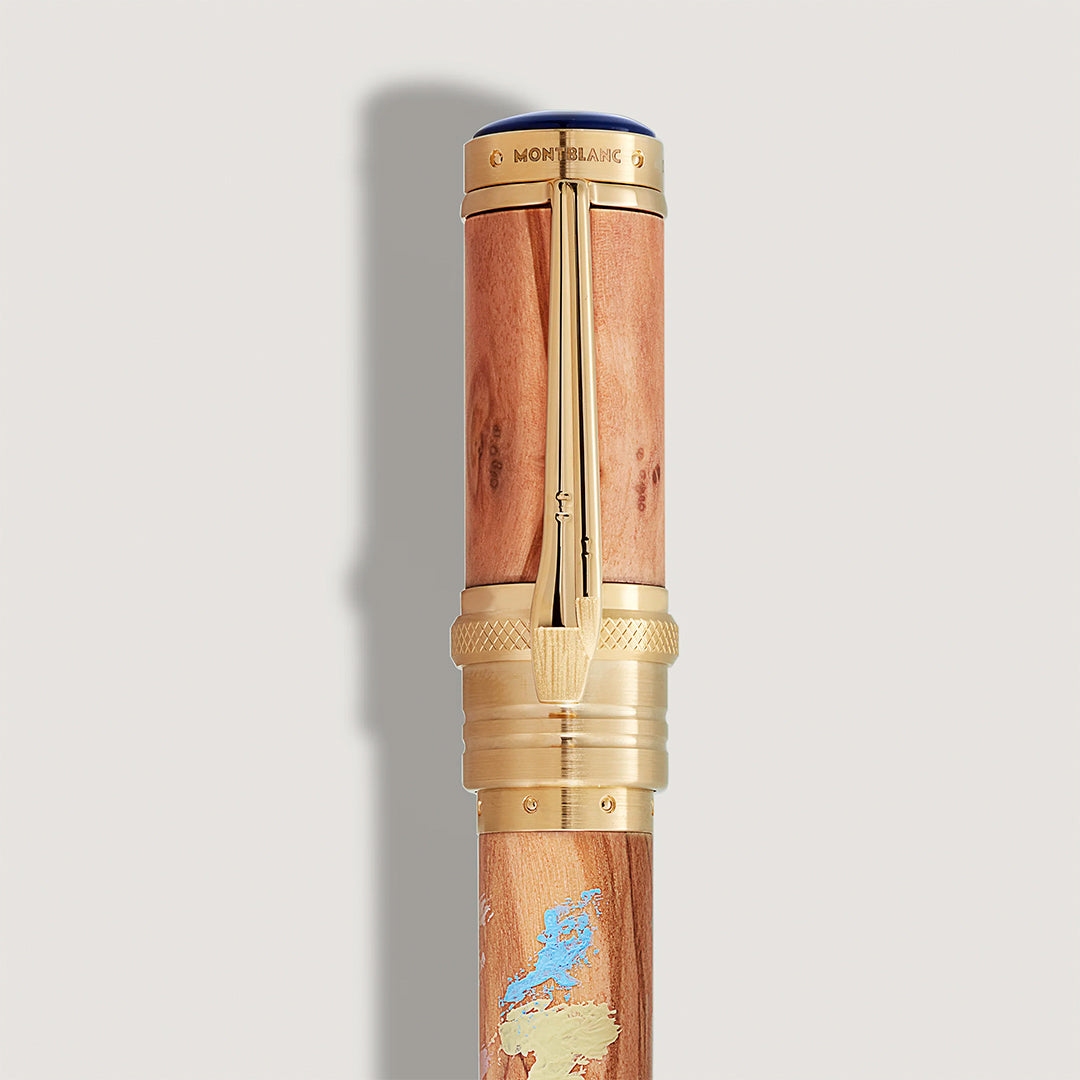 The Montblanc Masters of Art Homage to Pierre-Auguste Renoir Limited Edition 4810 Fountain Pen features gold accents, an engraved map, blue barrel details, and honors Impressionism by Renoir.