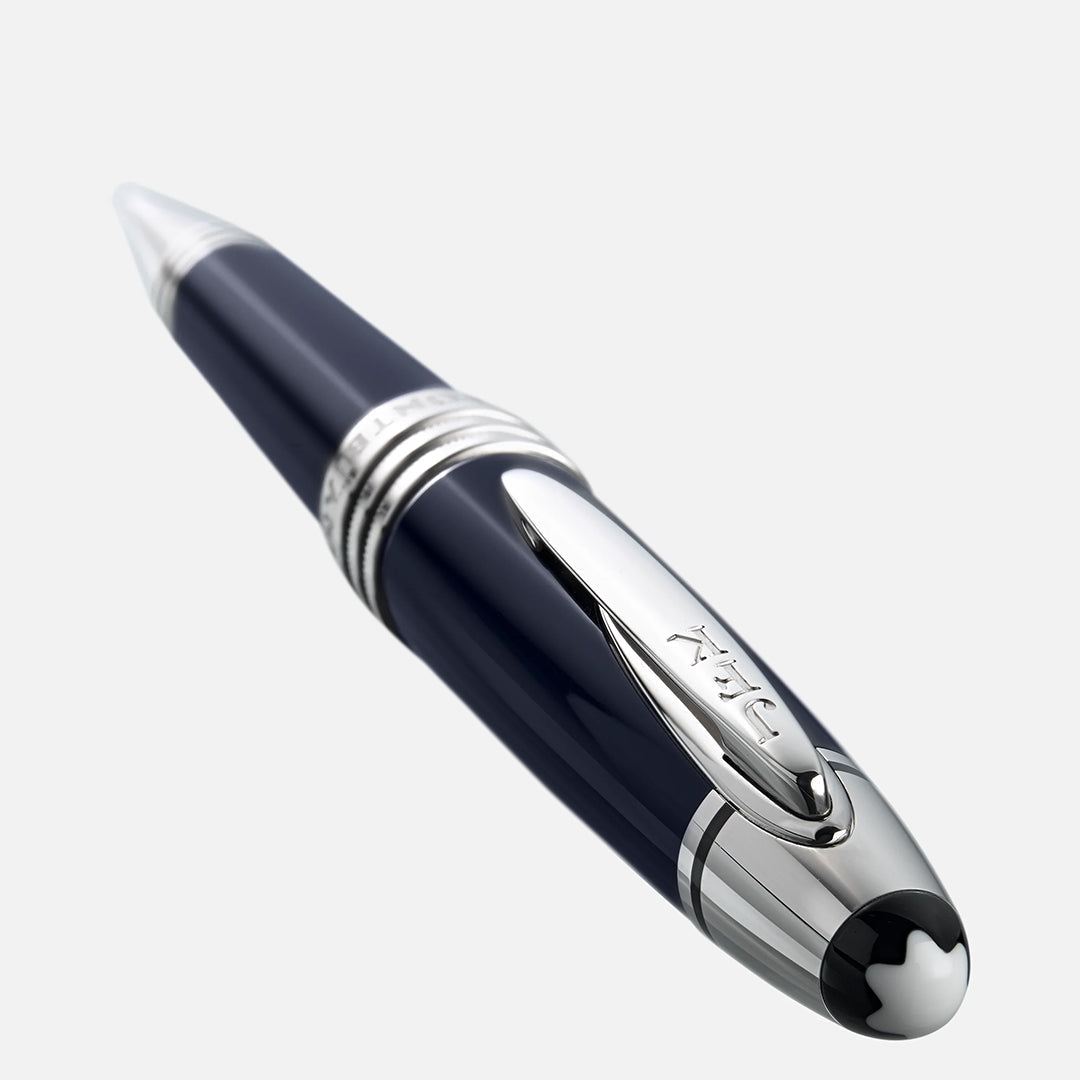 Introducing the Montblanc John F. Kennedy Special Edition Ballpoint Pen—a luxurious creation with a glossy black body, silver accents, elegant clip, and intricate engraving near the tip. The cap displays the iconic Montblanc emblem, all set against a light gray background.