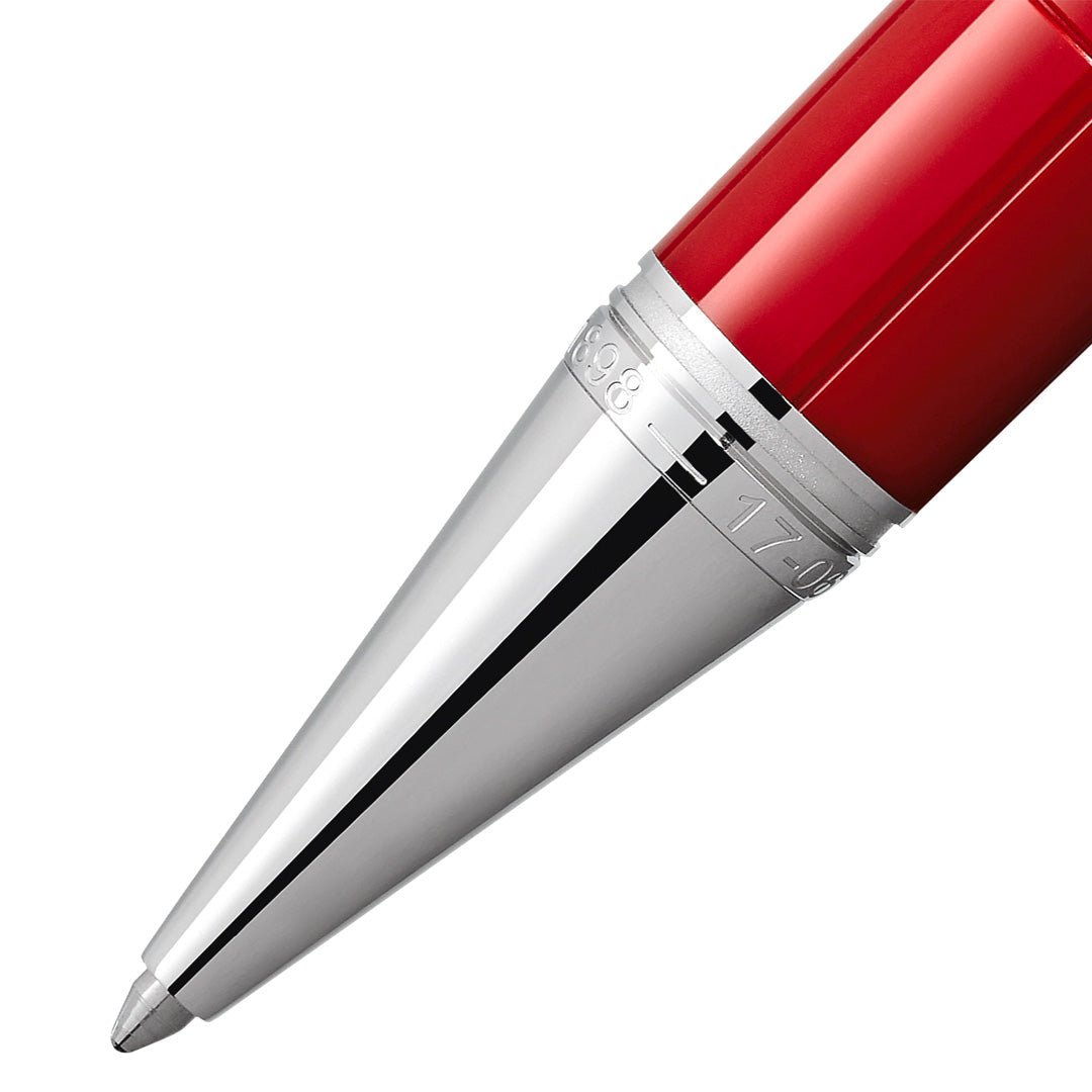 Close-up of the tip of the Montblanc Great Characters Enzo Ferrari Special Edition Ballpoint Pen, highlighting the gleaming silver cone and a section of its striking red barrel above, set against a white background—a detail that reflects Montblanc’s signature refined craftsmanship.