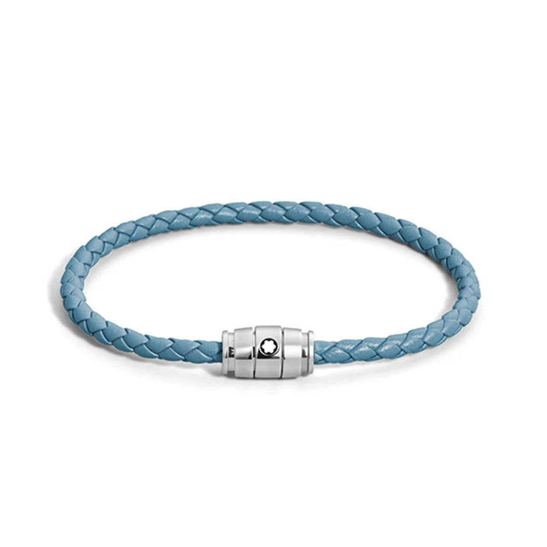 The Montblanc Meisterstuck 3 Rings Smoky Blue Leather Bracelet features light blue braided leather and a silver cylindrical clasp with a small black and white emblem, offering refined style from Montblanc.