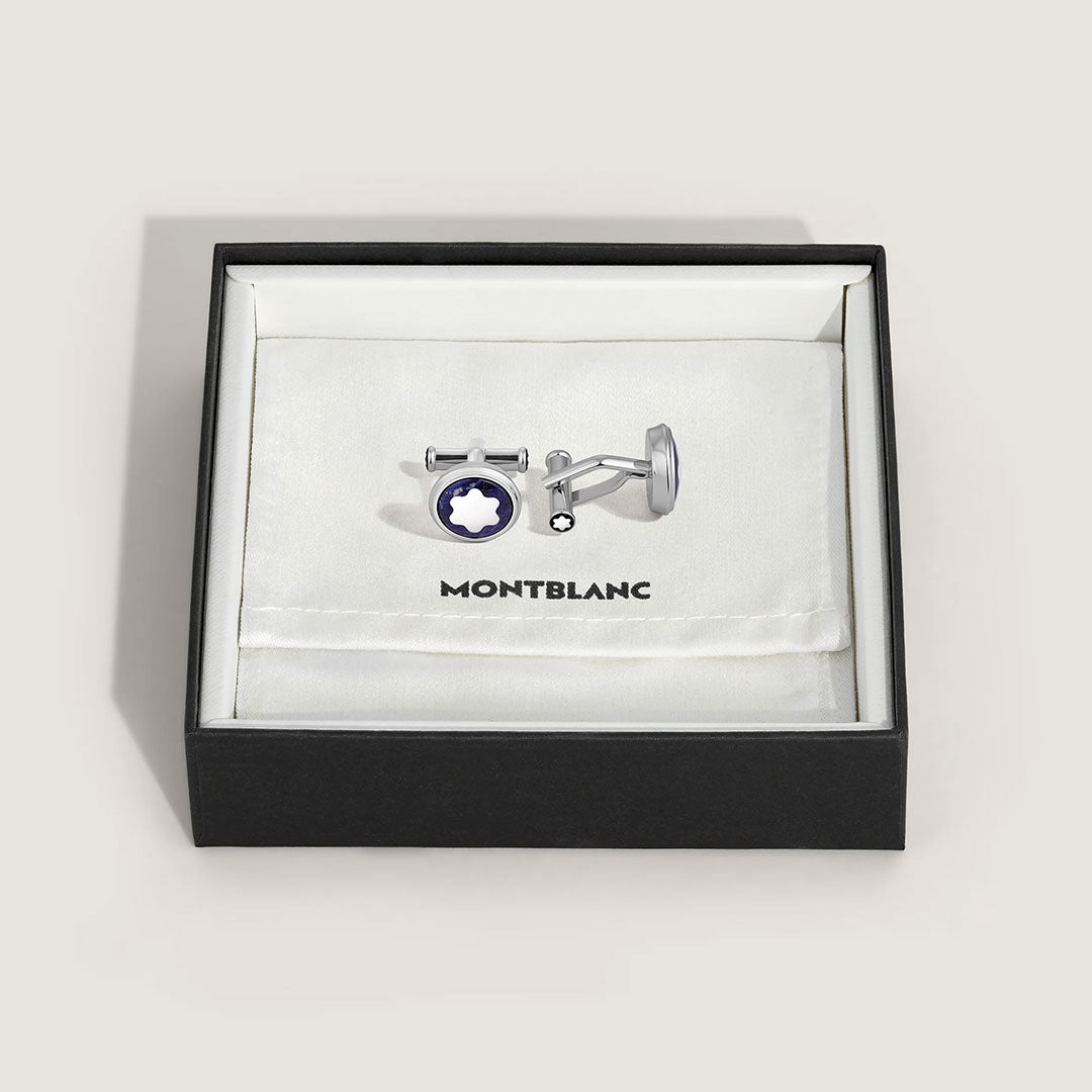 A pair of Montblanc Master Of Arts Homage To Pierre-Auguste Renoir cufflinks, silver-toned with a black and white star emblem, displayed in an open black box lined with white fabric and the Montblanc logo inside.