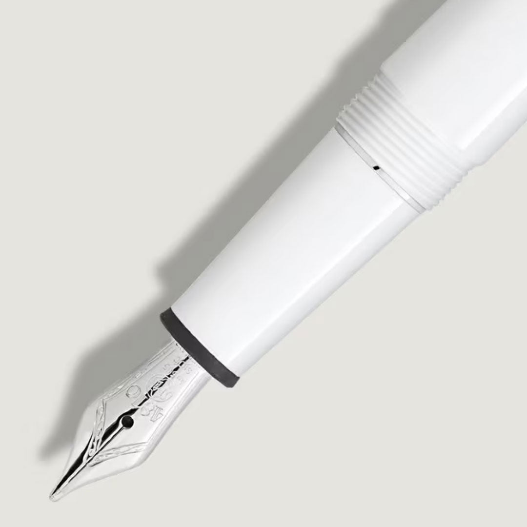 Close-up of the Montblanc Meisterstuck White Classique Fountain Pen M, crafted in white precious resin with a silver-engraved nib, set against a light gray background.
