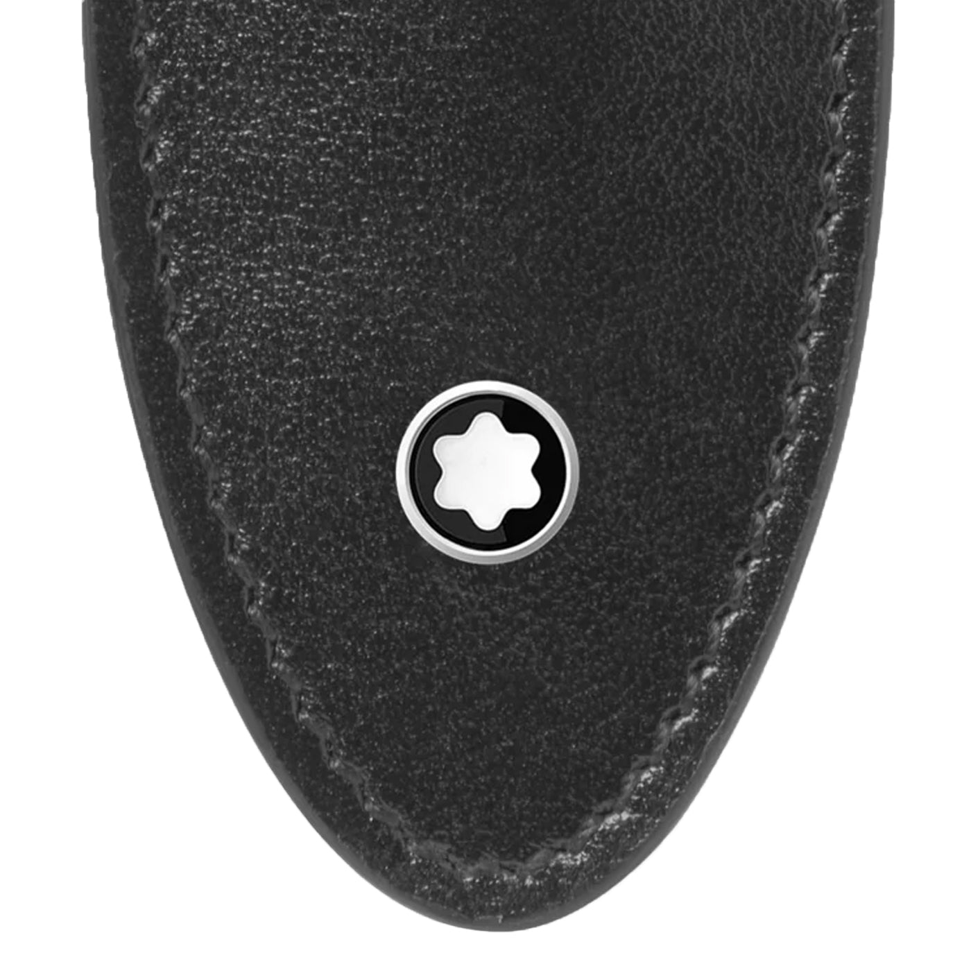 A close-up view of the Montblanc Meisterstück Black Writing Instrument Pouch showcases its smooth black leather design with a rounded bottom. The pouch is highlighted by intricate stitching along the edge and features a silver circular emblem with a white star design centered in a black circle near the tip.