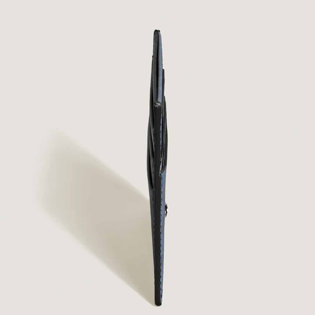 The Montblanc Extreme 3.0 6cc Leather Card Holder, expertly crafted from full-grain leather, is displayed from a side view against a neutral background, emphasizing its slim profile as the ultimate card holder.