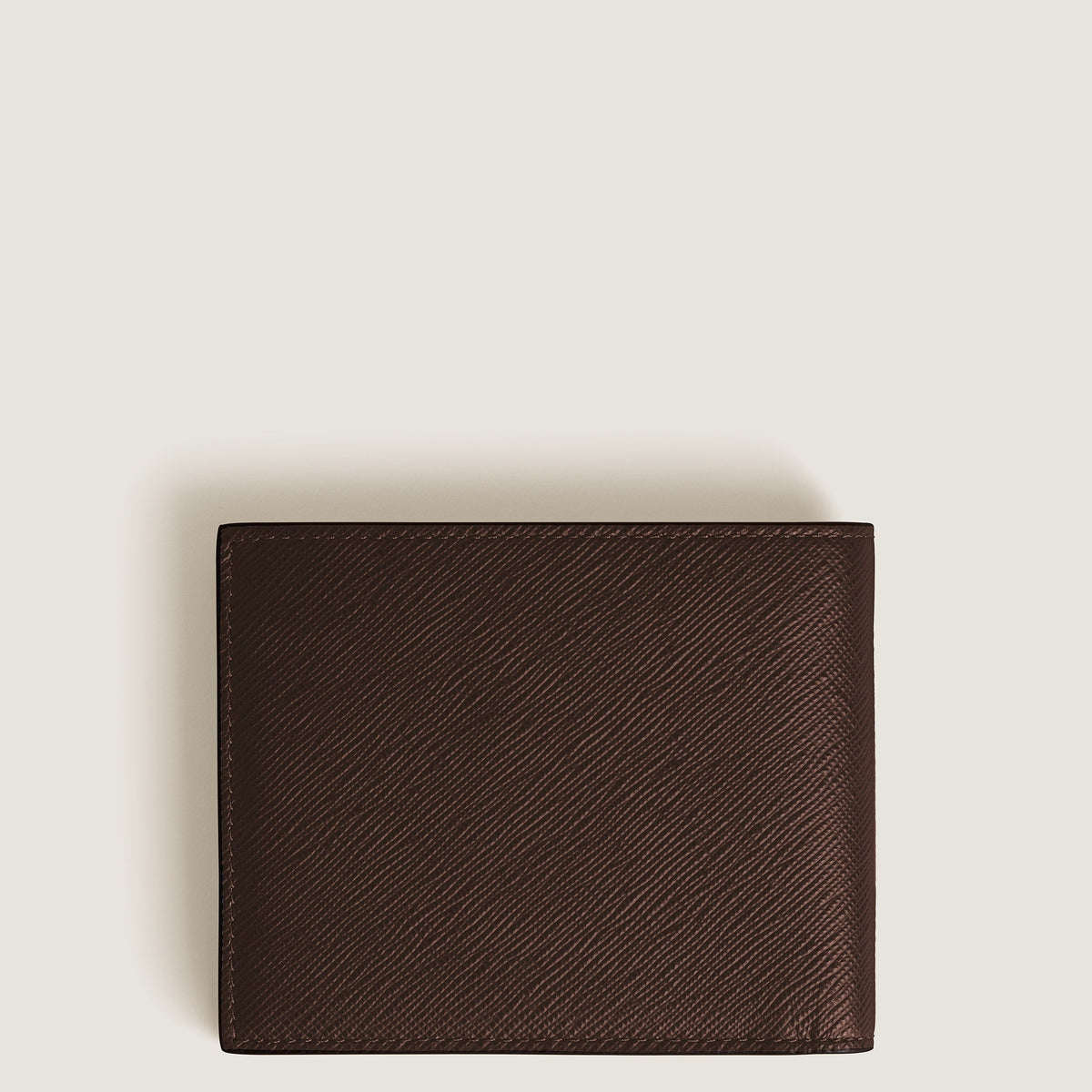 A closed Montblanc Sartorial 6CC Leather Wallet in dark brown leather is centered on a plain off-white background, highlighting its textured finish.