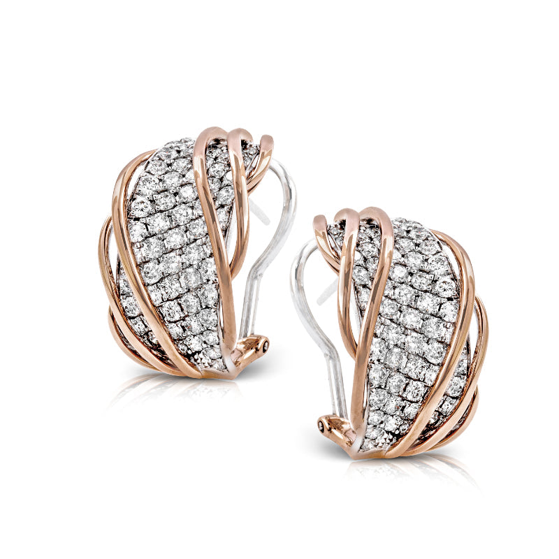 These sophisticated Simon G. earrings feature a captivating blend of 18 karat white and yellow gold, embellished with multiple rows of dazzling diamonds. The clip-on fastening merges luxury with a detailed design.