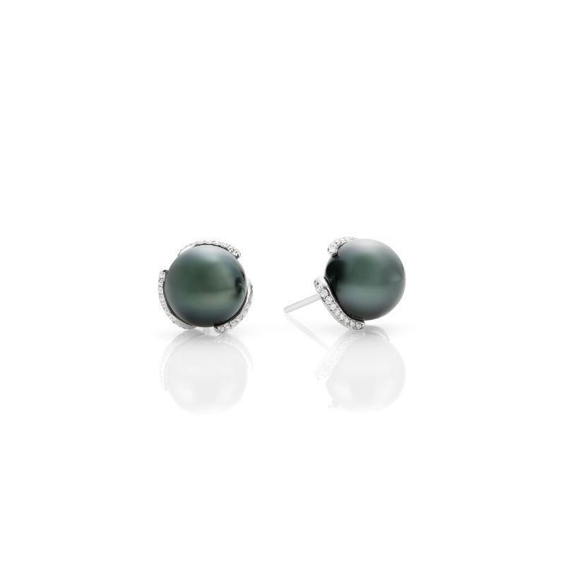 The Mikimoto Embrace 18K White Gold Diamonds with Black South Sea Cultured Pearl Stud Earrings by Mikimoto features elegant studs adorned with large Black South Sea Pearls, each surrounded by small sparkling diamonds on a reflective 18 Karat White Gold setting.