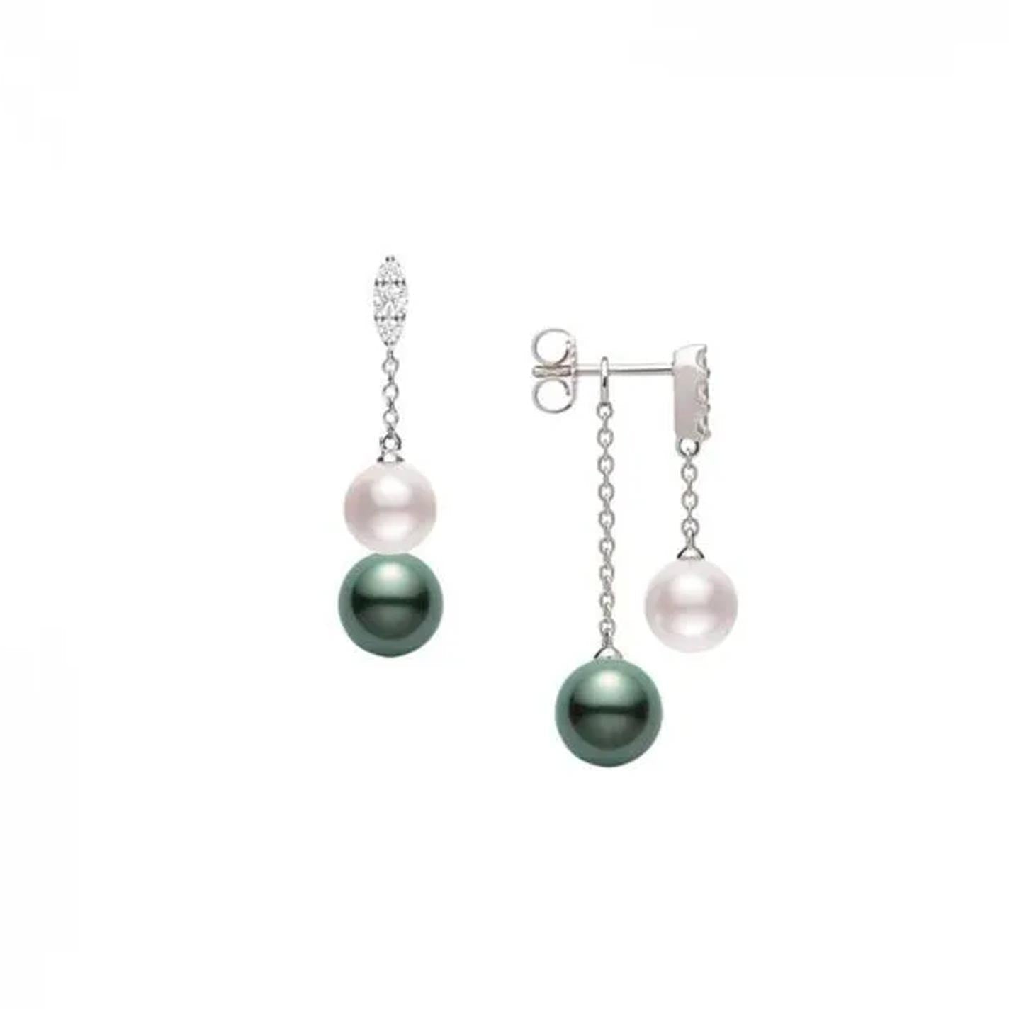 Experience sophistication with the Mikimoto Morning Dew 18K White Gold Drop Earrings. Featuring striking white and black Akoya cultured pearls suspended from silver chains, these earrings are enhanced by a decorative stud of sparkling diamonds. The pearls, elegantly hanging at varying lengths, are tastefully complemented by elements crafted in 18k white gold for a truly refined style.