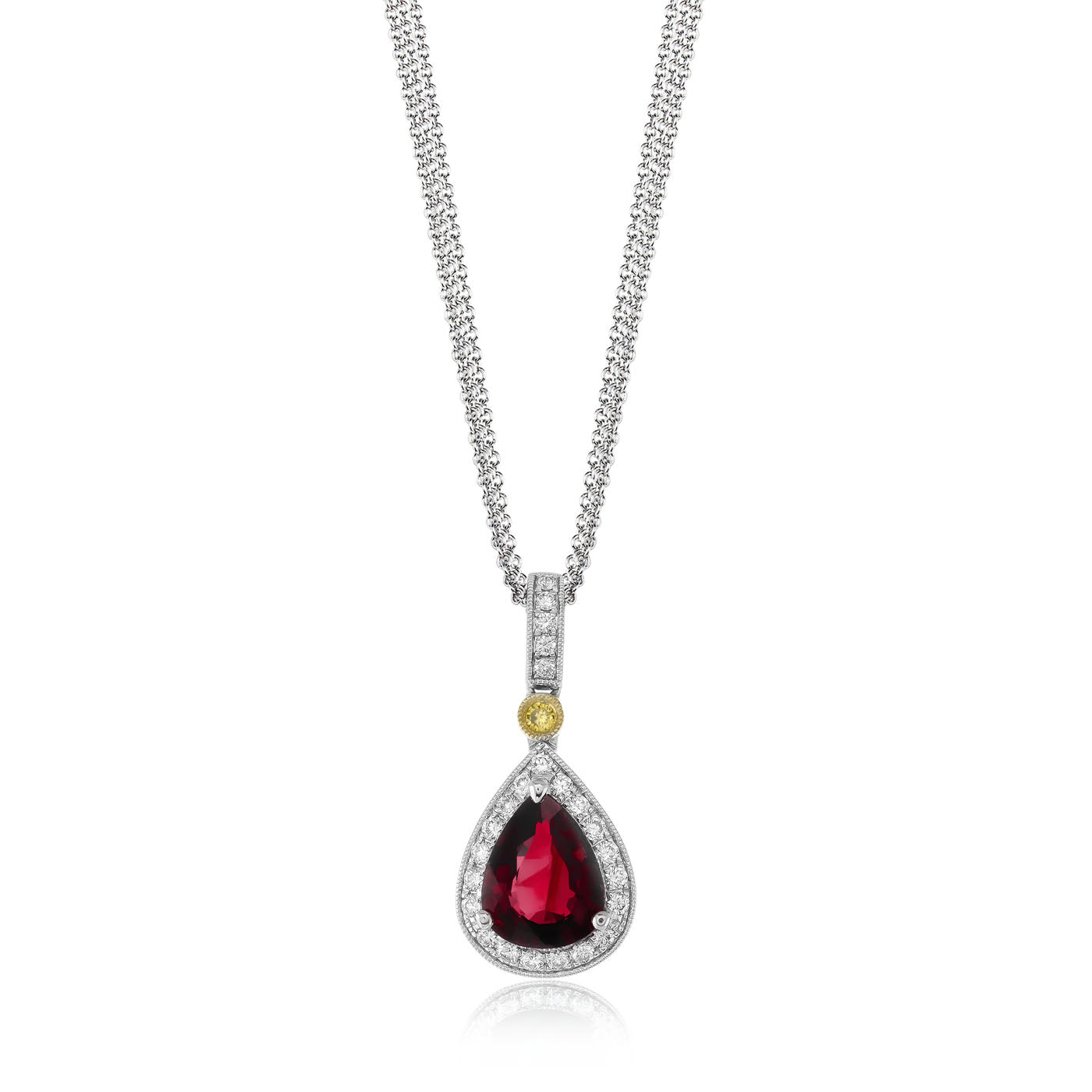 Introducing the Simon G 18K White and Yellow Gold Necklace, showcasing a captivating pear-shaped ruby pendant encircled by a halo of sparkling diamonds. The pendant is elegantly suspended from a bail adorned with diamonds and highlighted by an elegant yellow gemstone accent.