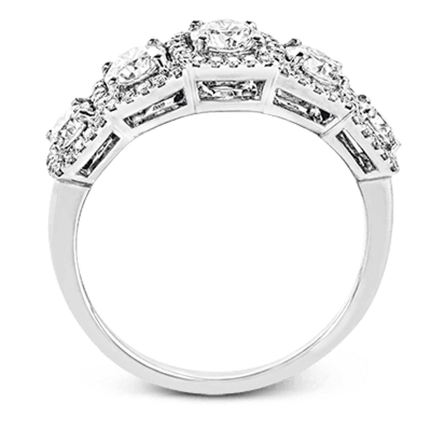 Introducing the Simon G. 18K White Gold Emerald with Diamond Ring: a sophisticated piece featuring a row of seven gleaming gemstones, elegantly arranged in a symmetrical setting. Each stone is meticulously held in claw settings that amplify their shine. The modern white gold band is expertly crafted and polished to accentuate the exquisite display of these radiant gems.