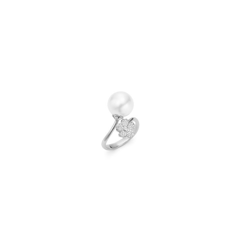 Introducing the Mikimoto Cherry Blossom ring: a stunning piece in 18K white gold, featuring an Akoya cultured pearl on one end and a delicate cherry blossom-shaped diamond cluster on the other, set against a plain white background.