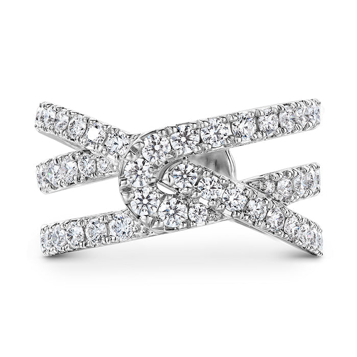 The Hearts On Fire Optima 18K white gold wrap fashion ring boasts a sophisticated crisscross design adorned with numerous small, round brilliant diamonds along the bands, offering a modern and elegant look.