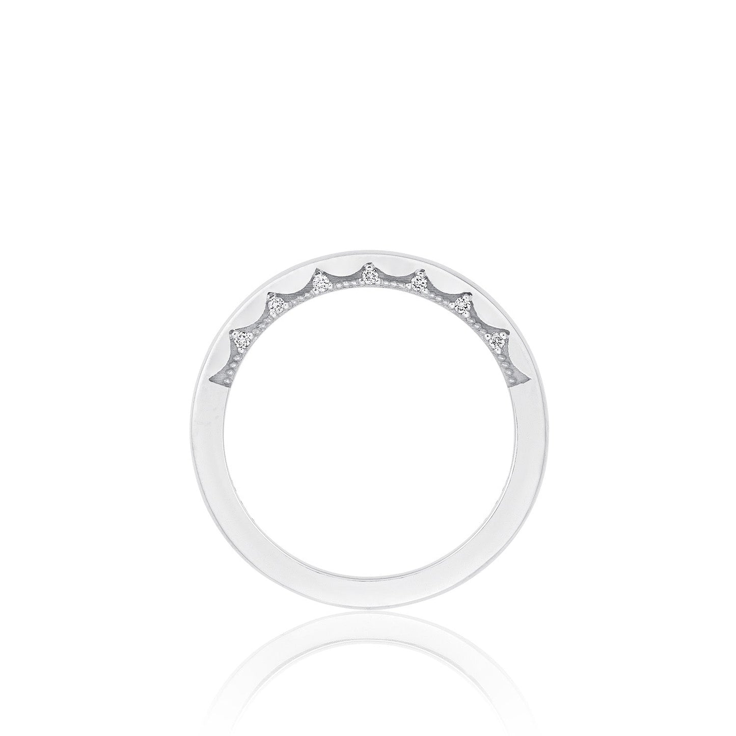 Introducing the Tacori Coastal Crescent High Polish Finish 14K White Gold Anniversary Ring With Diamond Accent. This stunning silver ring features a minimalist design with small diamond accents gracefully arranged along the top. Crafted with the same expertise found in Tacori's renowned gemologists, it showcases a smooth, polished finish on an elegant white gold background.
