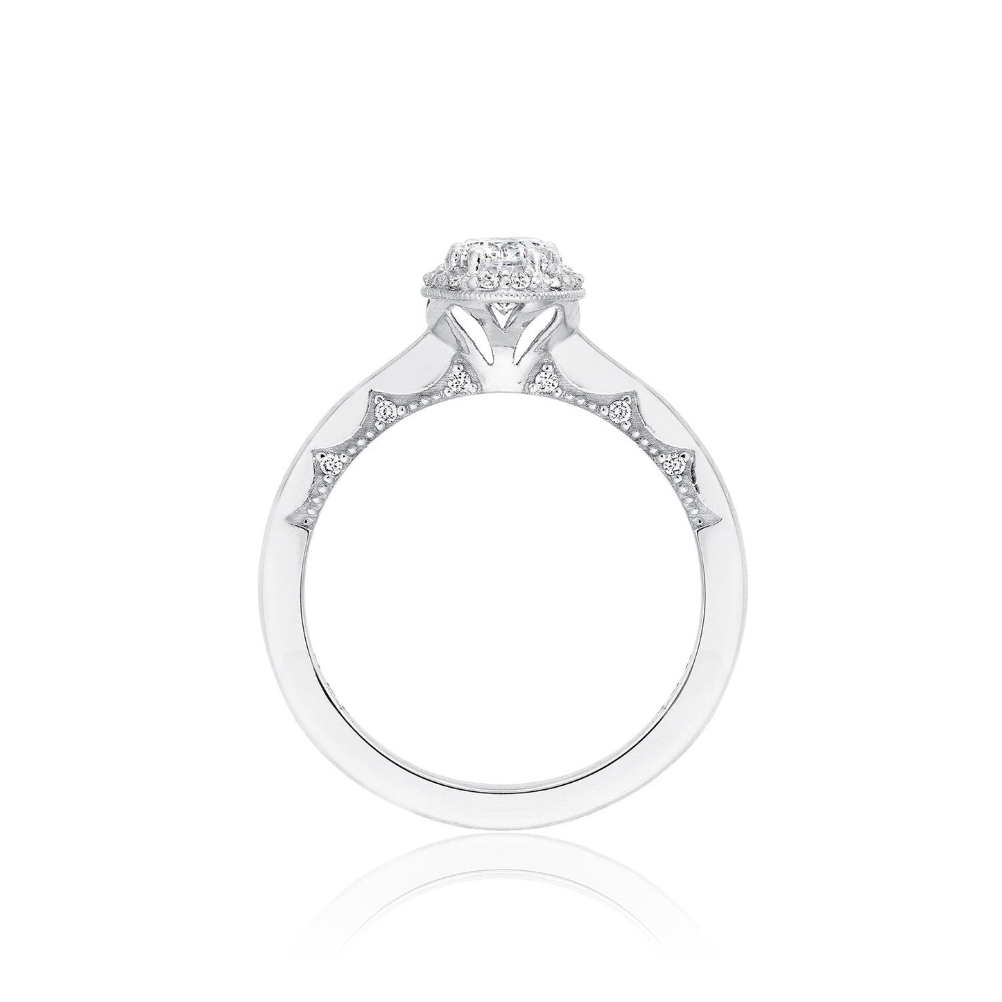 The Tacori Coastal Crescent 14K White Gold Oval Semi Mount with Diamond Band and Halo Engagement Ring showcases a white gold band adorned with an oval diamond encircled by an intricate halo design. The sparkling diamonds along the sides amplify its elegance and allure, reminiscent of the tranquil beauty of coastal horizons.
