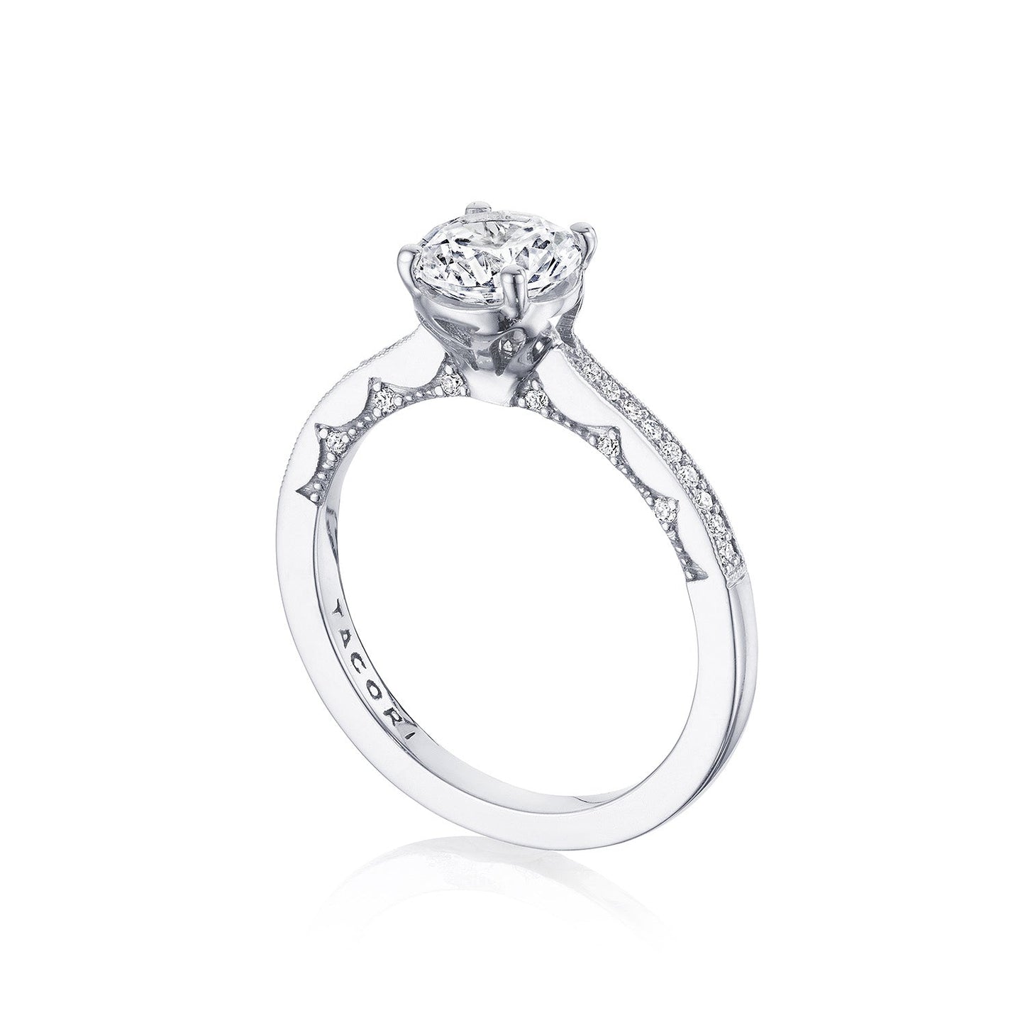 The Tacori Coastal Crescent 14K White Gold Round Brilliant Solitaire Semi Mount with Diamond Band Engagement Ring showcases a breathtaking round-cut diamond at its center. The band, designed with a cathedral foundation, is embellished with smaller diamonds, elevating the elegance and sparkle of the entire piece.
