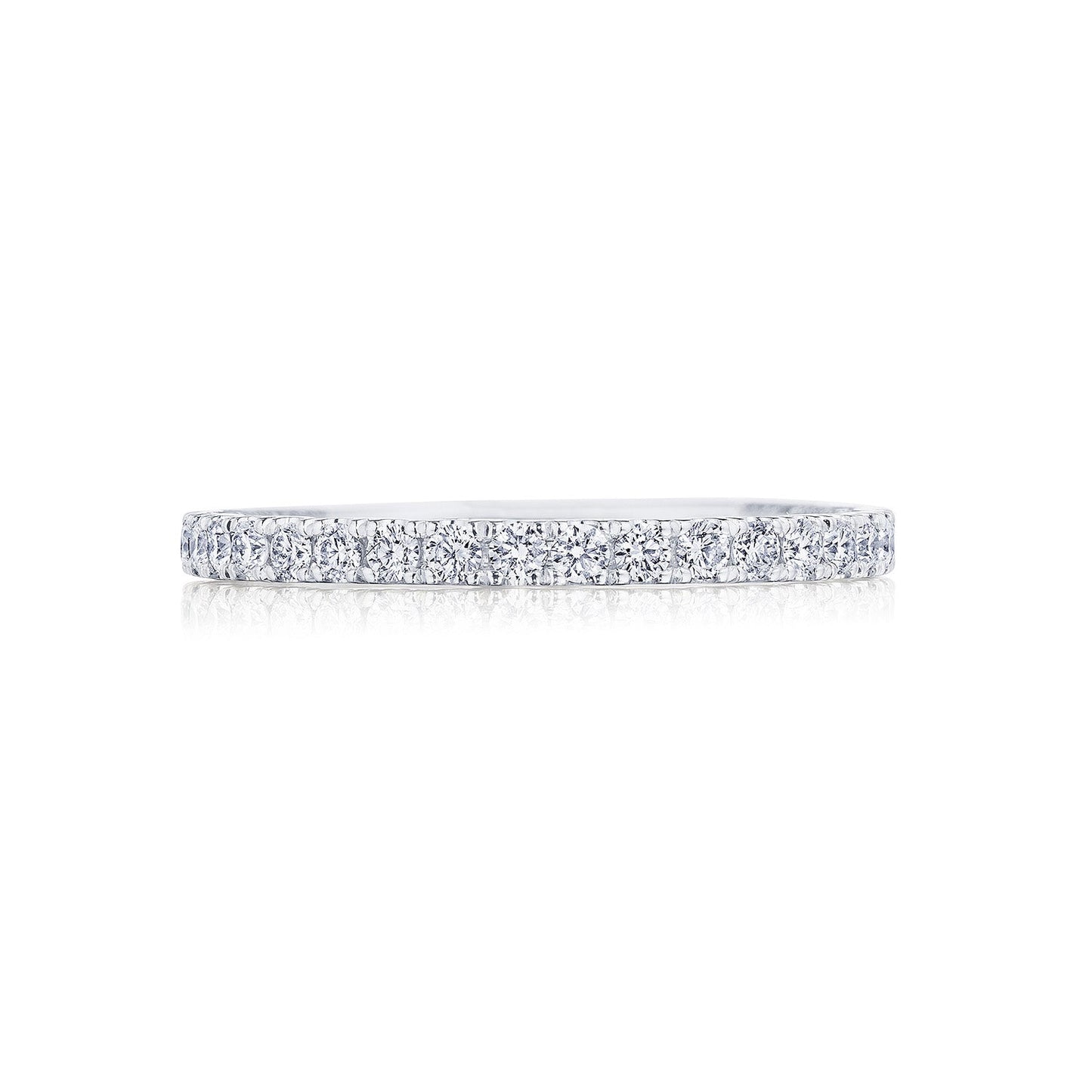 The Tacori Coastal Crescent 14K White Gold Round Brilliant French Pavé Diamond Anniversary Ring gleams magnificently against a white background, showcasing its elegant band adorned with sparkling diamonds.