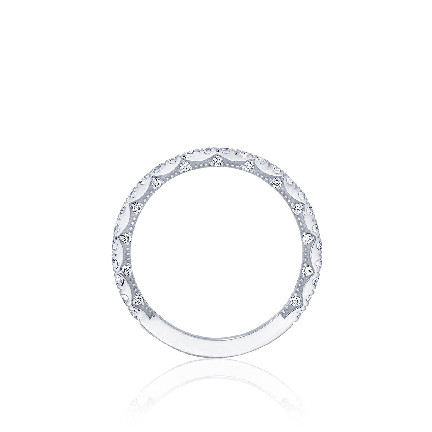 Presenting the Tacori Coastal Crescent 14K White Gold Round Brilliant French Pavé Diamond Anniversary Ring: an elegant, slender band adorned with intricately set round brilliant diamonds in a French pavé arrangement. Expertly crafted by Tacori gemologists, this luxurious ring is showcased on a pristine white background, highlighting its sophisticated design.