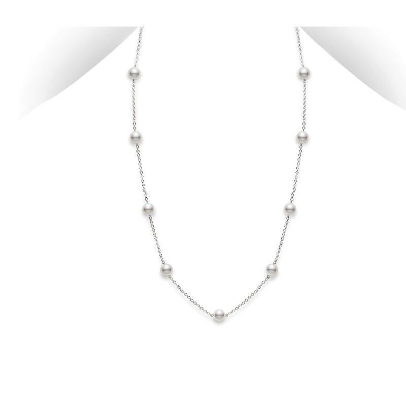 The Mikimoto 18K White Gold Akoya Cultured Pearl Station Necklace showcases a refined design with a slender white gold chain embellished with evenly spaced Akoya pearls, set against a plain white backdrop.