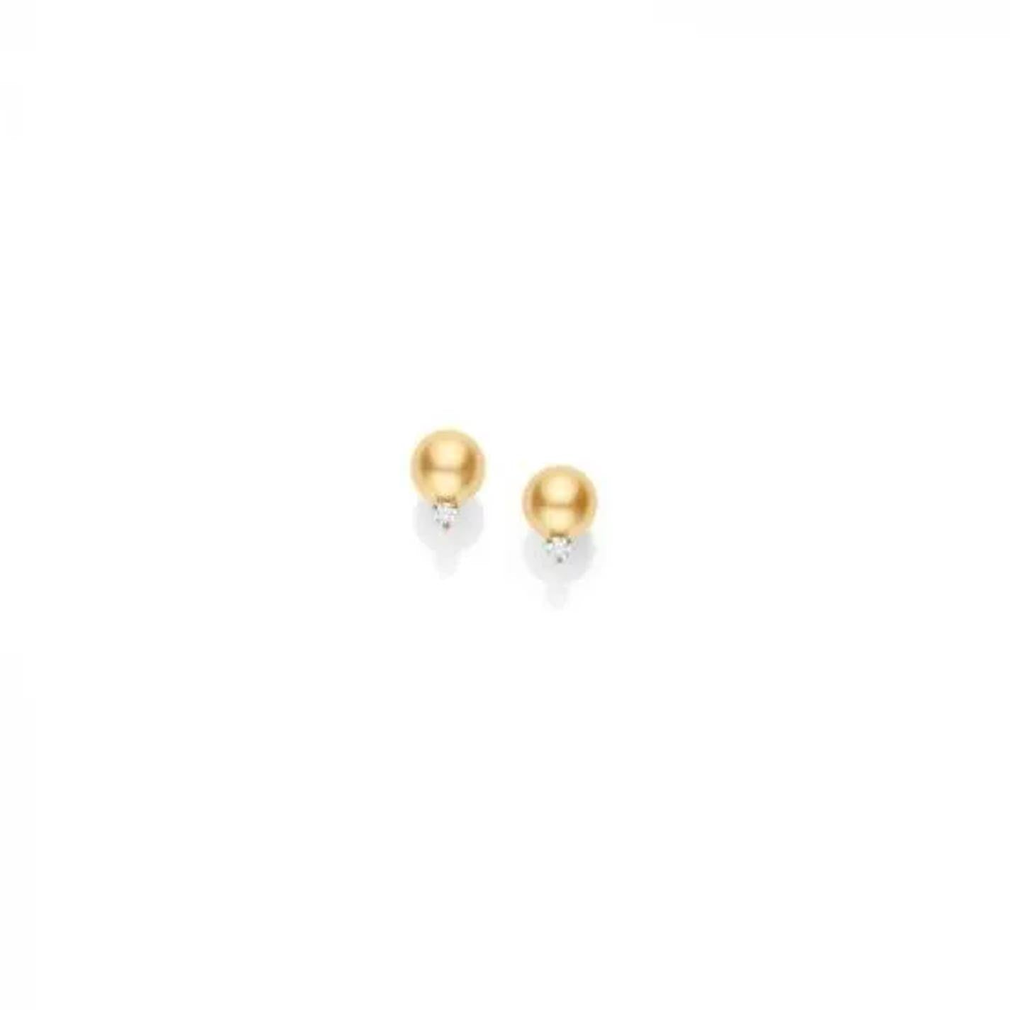 The Mikimoto 18K Yellow Gold Diamond with Golden South Sea Pearl Stud Earrings showcase golden spherical studs crafted from 18K yellow gold and accented with tiny clear gems, all set against a plain white background.
