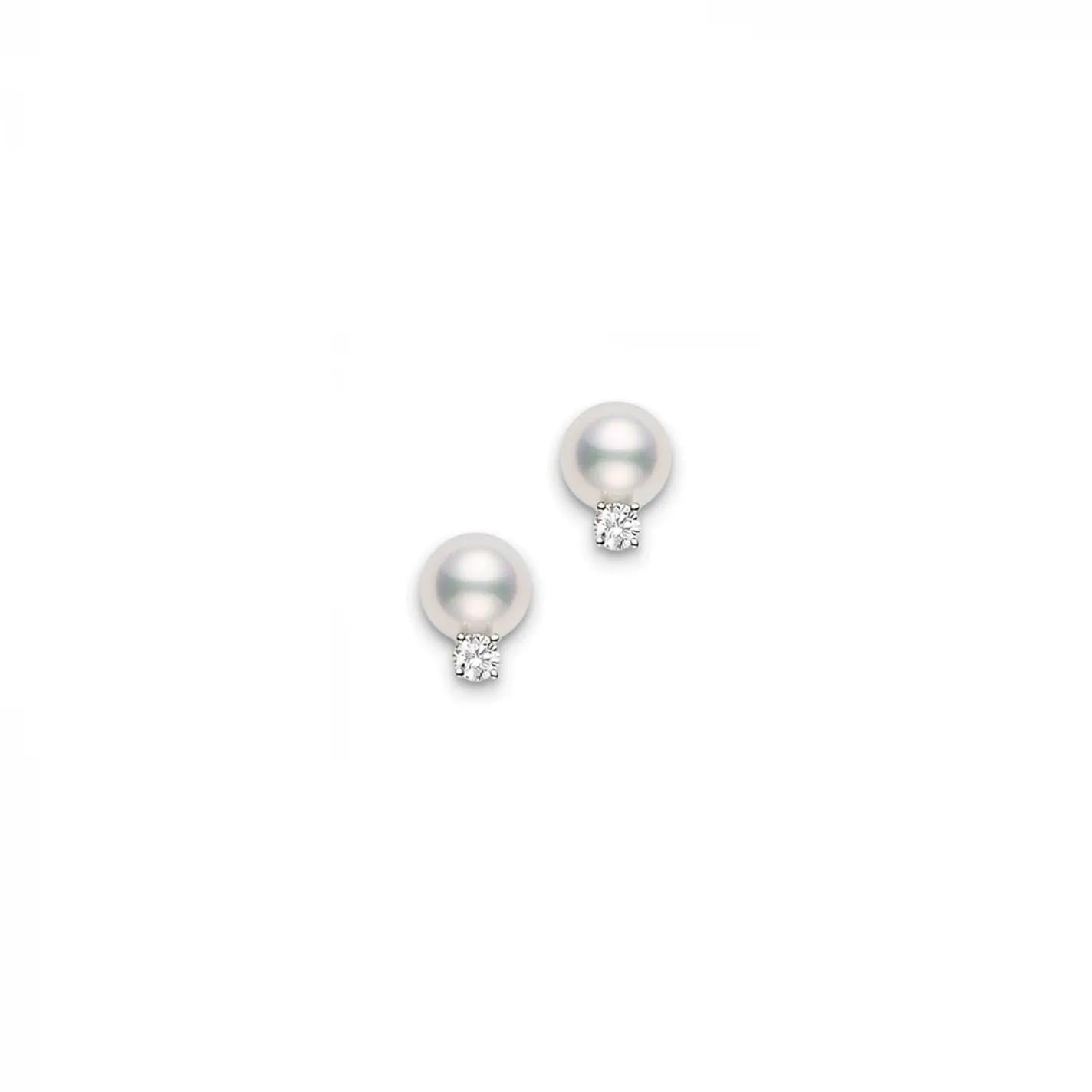 The Mikimoto 18K White Gold Diamond with South Sea Pearl Stud Earrings combine round South Sea pearls set against glistening diamonds on a backdrop of 18 Karat white gold.
