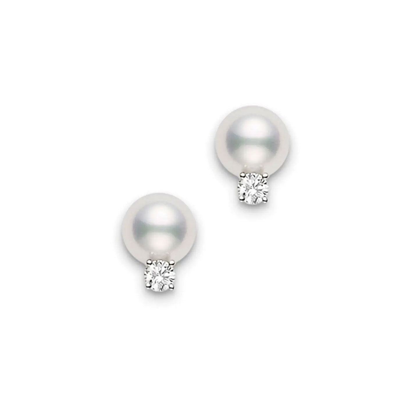The Mikimoto 18K White Gold Diamond with Akoya Cultured Pearl Stud Earrings showcase a pair of sophisticated pearl earrings crafted in white gold. Each earring features a radiantly round Akoya cultured pearl complemented by a glistening diamond beneath, all beautifully presented against a simple white background.