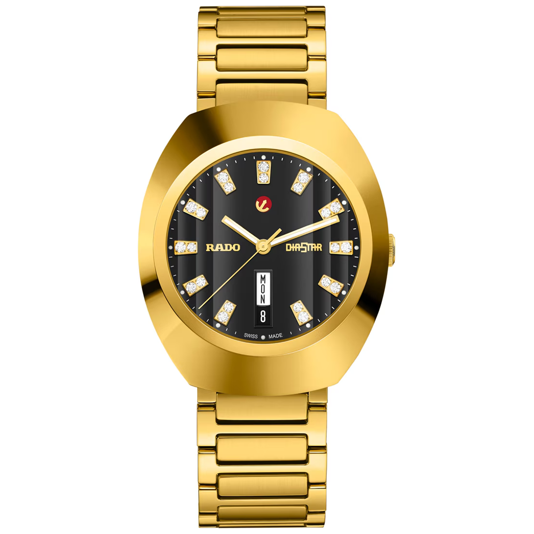 RADO DiaStar Original Automatic 38mm watch in yellow gold PVD with a wide oval case, black dial featuring diamond hour markers, and a day-date window at the six o’clock position.