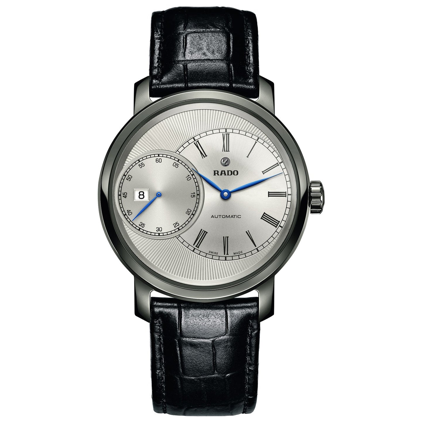 The RADO DiaMaster Grande Seconde Automatic 43mm Watch is a stylish accessory, featuring a silver dial with Roman numerals, a date function, and two subdials. Complemented by a durable ceramic case and a black leather strap, this watch proudly displays the "Rado" branding on its sophisticated face.