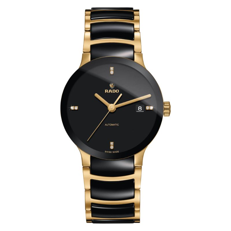 The RADO Centrix Automatic 38mm Watch embodies sophistication with its black dial and gold-tone markers. It boasts a sapphire crystal and a date display at the 3 o'clock position, complemented by an elegant gold and black metal bracelet. This timepiece is proudly "Swiss Made.