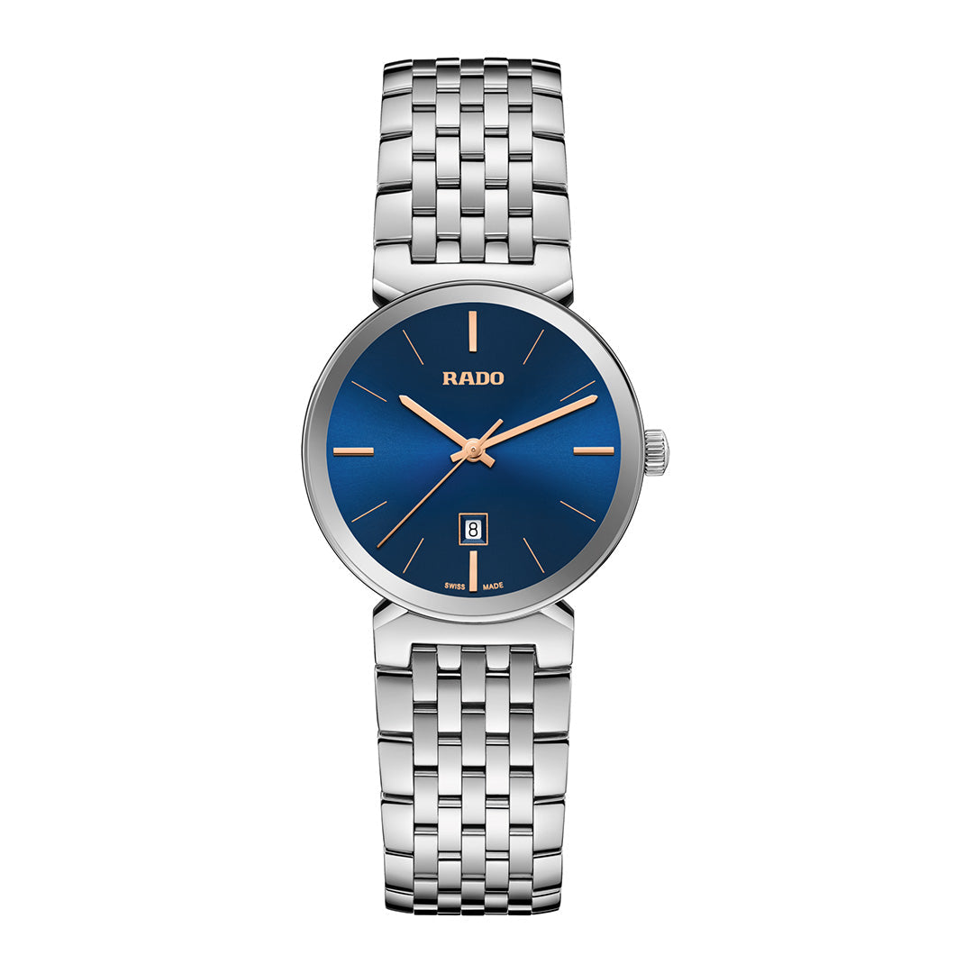 The RADO Florence Quartz 30mm Watch features a silver-tone design, blue dial, rose gold hands and markers, date at 6 o’clock, sapphire crystal, and stainless steel bracelet.
