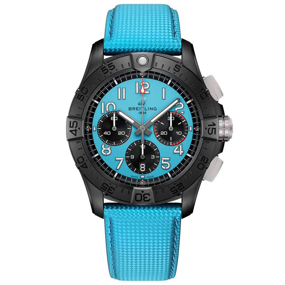 The BREITLING Avenger B01 Chronograph 42 Night Mission by Breitling features a turquoise blue dial with black subdials, bold white numerals, and a matching turquoise textured strap in a striking black and silver stainless steel design.