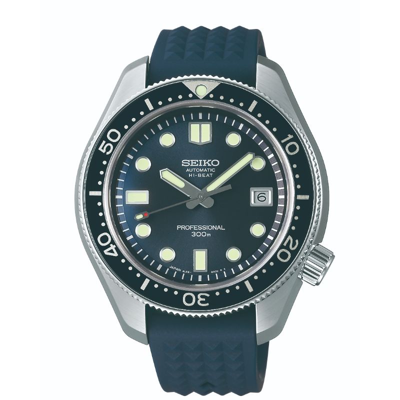 The Seiko Prospex Diver's 55th Anniversary Limited Edition Automatic with Manual Winding 44.8mm Watch boasts a black dial with bold luminous markers, a date window at 3 o'clock, and a black rotating bezel. It is complemented by a blue rubber strap and features "Automatic Hi-Beat Professional 300m" markings.
