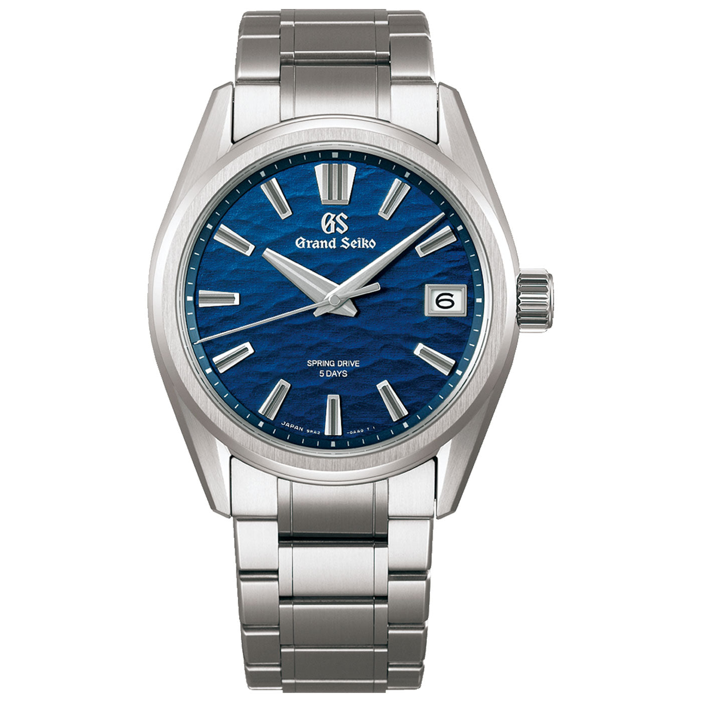 The Grand Seiko Evolution 9 Collection Spring Drive 40mm Watch features a captivating blue textured dial adorned with silver hour markers and hands, along with a date display at the 3 o'clock position. Highlighted by the "Spring Drive 5 Days" inscription, this stainless steel timepiece is paired with an elegant metal bracelet, combining both style and precision.