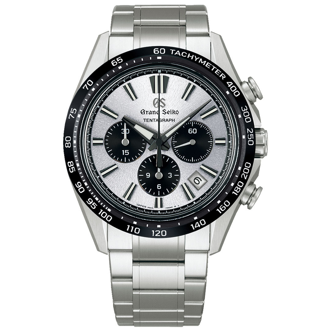 The Grand Seiko Evolution 9 Collection Automatic with Manual Winding Tentagraph 43.2mm Watch features a silver dial, three black sub-dials, date window, black tachymeter bezel, and stainless steel bracelet with silver-toned hands and markers.