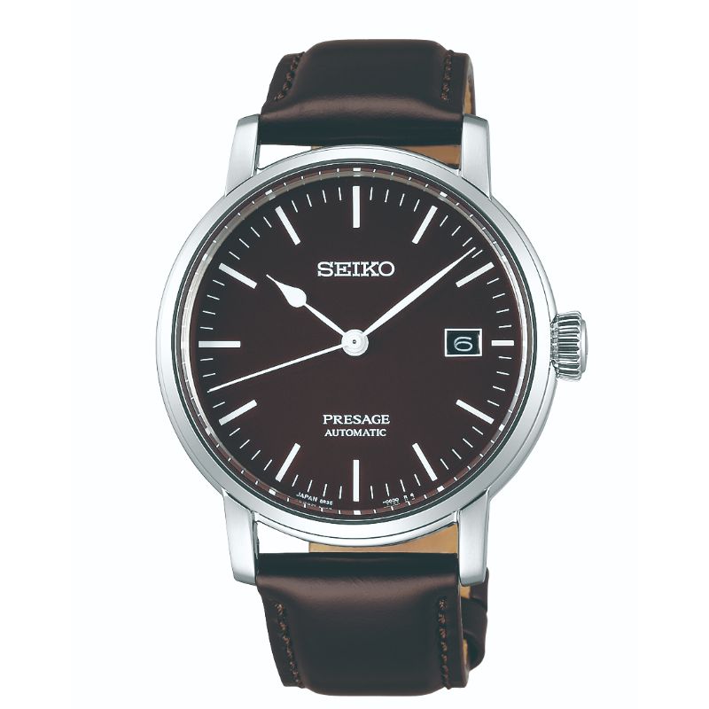 The Seiko Presage Prestige Line Automatic With Manual Winding 39.9mm Watch blends Japanese aesthetics with durable performance. Its sophisticated design includes a brown leather strap, a brown dial, and silver hour markers, all showcasing excellence in mechanical watchmaking. A stainless steel case completes this elegant timepiece.